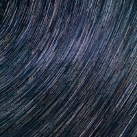 a star trail is seen in the night sky