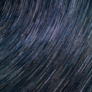 a star trail is seen in the night sky