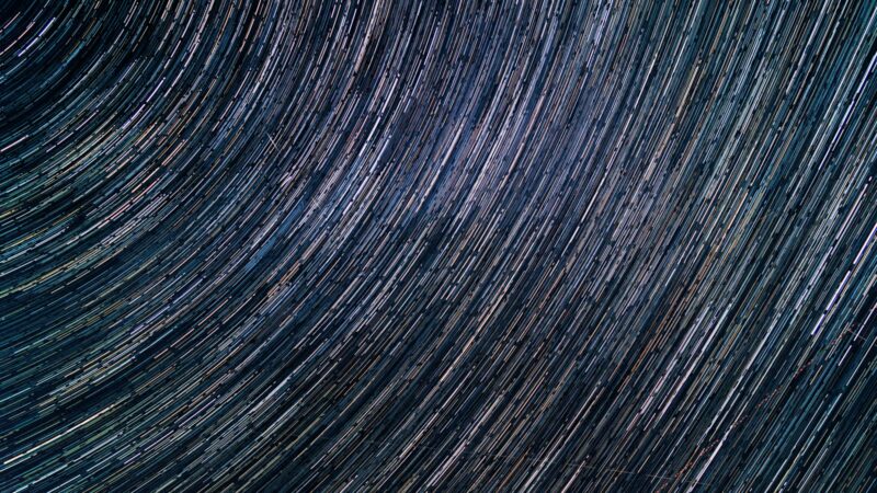 a star trail is seen in the night sky