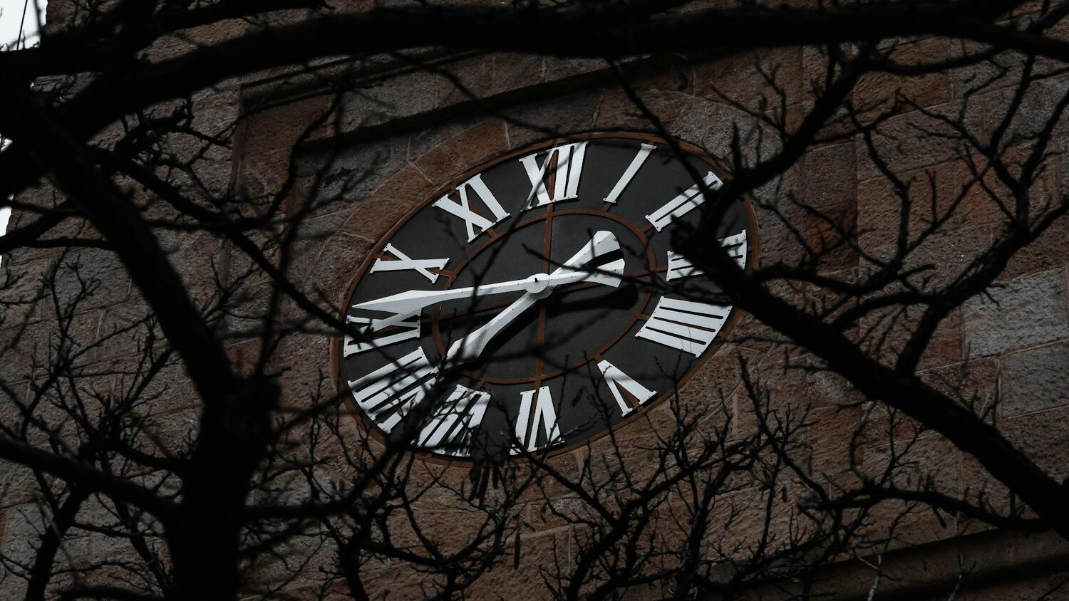a large clock tower with roman numerals on it